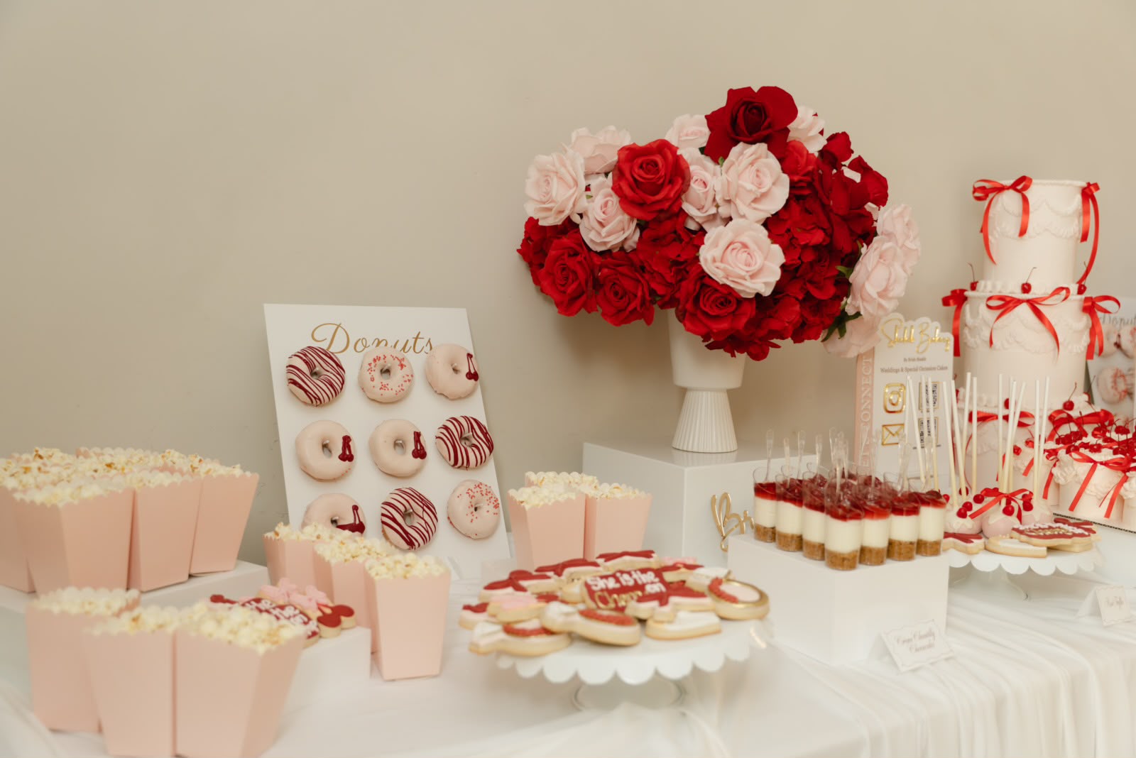 Luxury dessert table with cake, donuts and cheesecake shooters by Kabul Kitchen Ajax